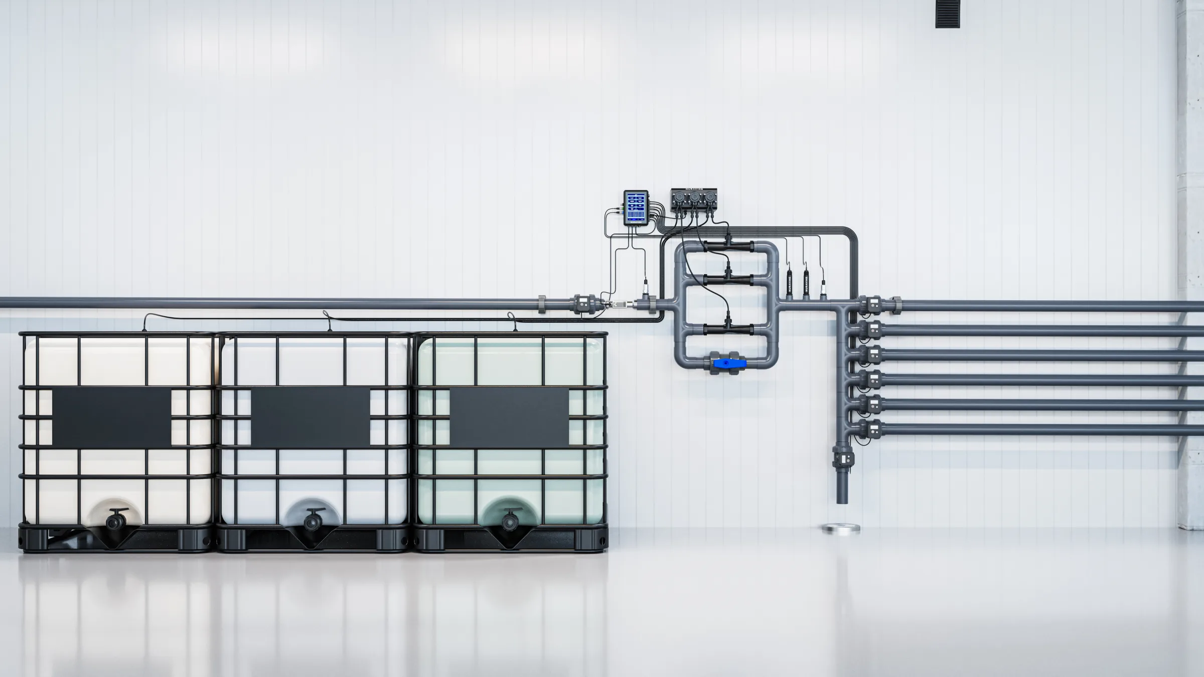 Large Nuravine inline dosing setup with three IBC totes feeding a multi-zone irrigation main