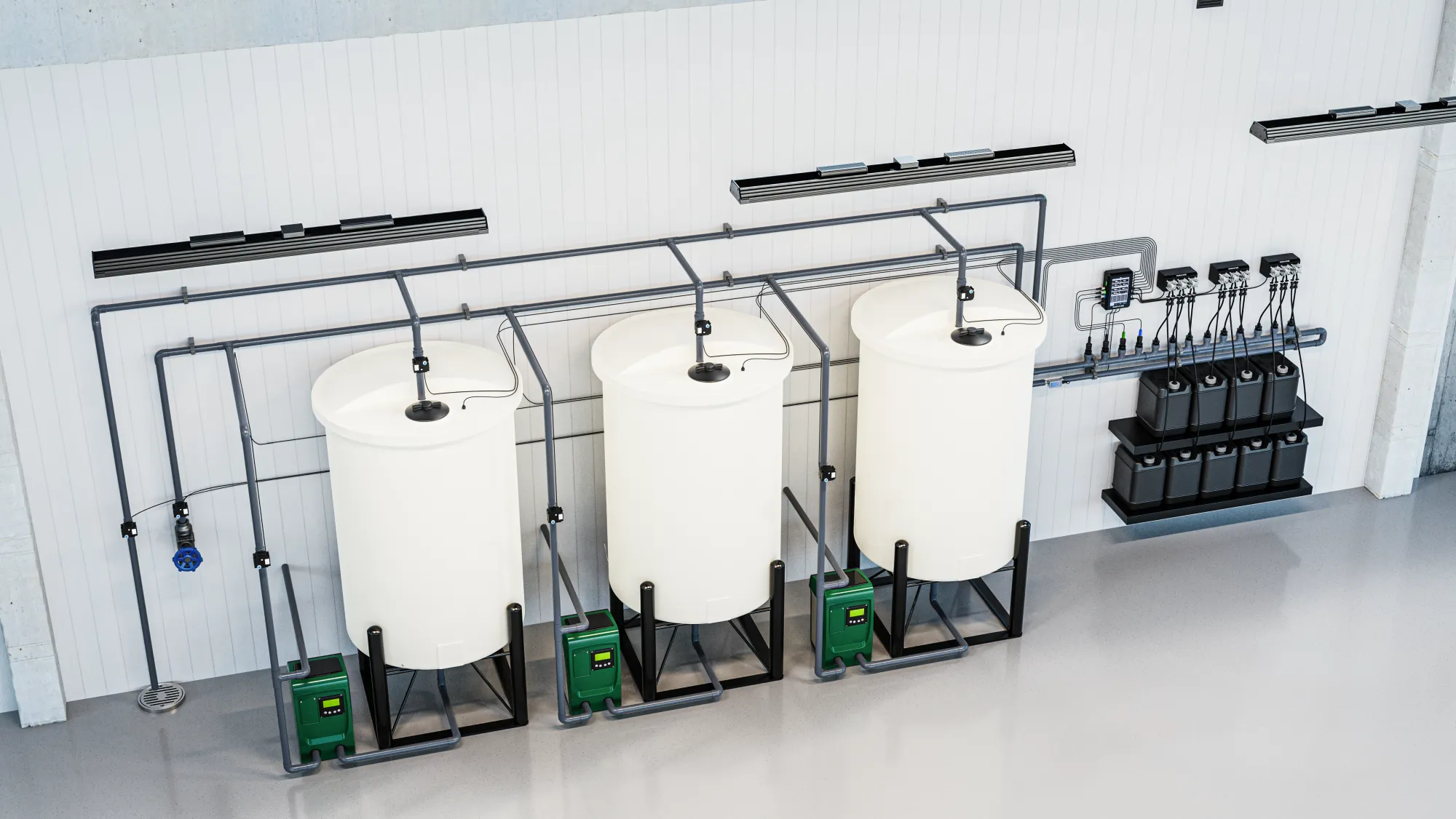 Three Nuravine batch tanks and a dosing wall with controller display, pumps, and nutrient jugs, viewed straight on