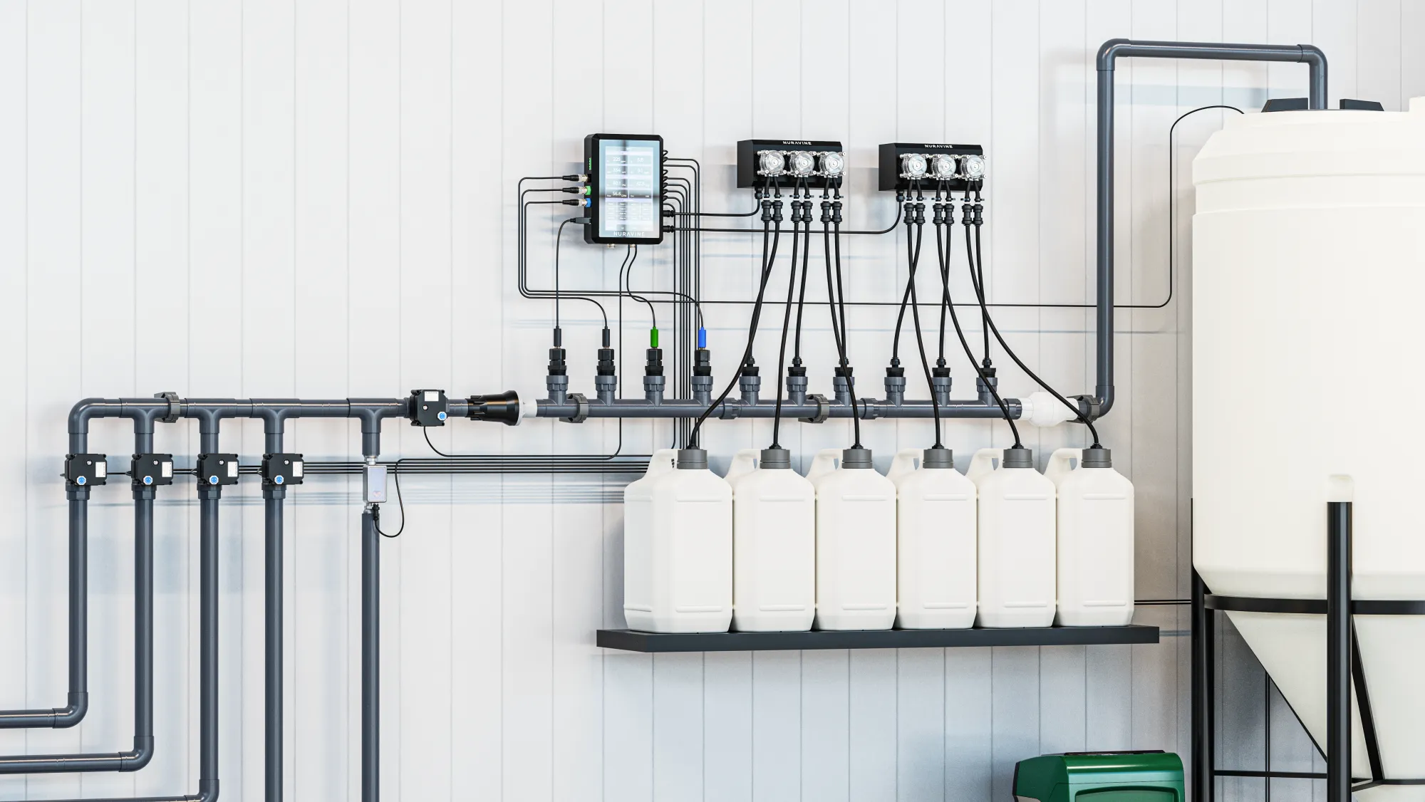 Close view of Nuravine nutrient jugs and dosing pumps beside a single-tank batch system